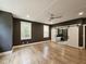 Spacious main bedroom features hardwood floors, neutral color, and a barn door leading to the ensuite bath at 97 Fox Oak Trl, Pittsboro, NC 27312