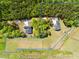 Aerial view of property lines showcasing land and homesite surrounded by beautiful trees at 9947 Nc Hwy 96 N, Selma, NC 27576