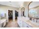 Bright bathroom with double sinks, soaking tub, and walk-in closet at 9947 Nc Hwy 96 N, Selma, NC 27576