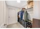 Walk-in closet with organizing shelves and drawers for folded clothes, and hanging racks at 9947 Nc Hwy 96 N, Selma, NC 27576