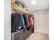 Spacious walk-in closet with plenty of hanging storage, shelves, and organizing baskets at 9947 Nc Hwy 96 N, Selma, NC 27576