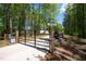 Secure gated entrance to the property offering privacy with an automatic gate system at 9947 Nc Hwy 96 N, Selma, NC 27576