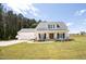 Beautiful two-story white home with a manicured lawn and inviting front porch at 9947 Nc Hwy 96 N, Selma, NC 27576