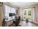 Well-lit office with a large desk, French doors, and large windows at 9947 Nc Hwy 96 N, Selma, NC 27576