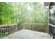 Private outdoor deck offers a tranquil view of the natural surroundings and mature trees at 1004 Longleaf Pine Pl, Mebane, NC 27302