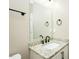 Bathroom features a granite countertop, black fixtures and a large mirror at 1004 Longleaf Pine Pl, Mebane, NC 27302