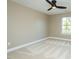 A comfortable bedroom features neutral paint, a ceiling fan, and a window offering natural light at 1004 Longleaf Pine Pl, Mebane, NC 27302