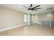 Large bedroom with spacious layout featuring railing and large ceiling fan at 1004 Longleaf Pine Pl, Mebane, NC 27302