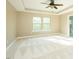 Large bedroom with trey ceilings, a ceiling fan, and natural light from the double windows at 1004 Longleaf Pine Pl, Mebane, NC 27302