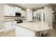 Bright kitchen features granite countertops, stainless steel appliances and white cabinetry at 1004 Longleaf Pine Pl, Mebane, NC 27302