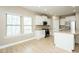 Bright kitchen with stainless steel appliances, hardwood floors and center island at 1004 Longleaf Pine Pl, Mebane, NC 27302