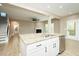 Open-concept kitchen with granite countertops and stainless appliances open to the living room at 1004 Longleaf Pine Pl, Mebane, NC 27302