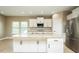 Spacious kitchen with a large central island, granite countertops and stainless steel appliances at 1004 Longleaf Pine Pl, Mebane, NC 27302