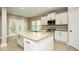 Beautiful kitchen features a large island, granite countertops, stainless appliances and ample cabinet space at 1004 Longleaf Pine Pl, Mebane, NC 27302