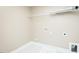 A utility room with washer/dryer hookups and wire shelving provides added convenience at 1004 Longleaf Pine Pl, Mebane, NC 27302