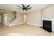 Hardwood floors, fireplace and modern staircase accent this spacious living room at 1004 Longleaf Pine Pl, Mebane, NC 27302