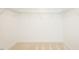 An organized walk-in closet features wire shelving and neutral carpeting for easy storage solutions at 1004 Longleaf Pine Pl, Mebane, NC 27302