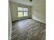 Comfortable bedroom featuring neutral decor and a bright window, creating a serene and inviting atmosphere at 1010 Pool Rock Rd, Henderson, NC 27537