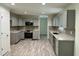 Modern kitchen features updated appliances, light countertops, and ample storage for cooking enthusiasts at 1010 Pool Rock Rd, Henderson, NC 27537
