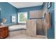 Modern bathroom with a soaking tub, walk-in shower, neutral tile, and a window with natural light at 1027 Upchurch Farm Ln, Cary, NC 27519