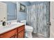 Bathroom with blue walls, carpet, and a vanity with mirror at 1027 Upchurch Farm Ln, Cary, NC 27519