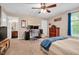 Spacious bedroom with office setup and ensuite bathroom access at 1027 Upchurch Farm Ln, Cary, NC 27519