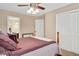 Bedroom with neutral walls, carpet, closet, and open door at 1027 Upchurch Farm Ln, Cary, NC 27519