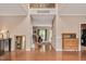 Grand foyer with hardwood floors, high ceilings, and a view of the staircase at 1027 Upchurch Farm Ln, Cary, NC 27519