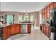 Open kitchen with granite countertops, stainless steel appliances, and views into the breakfast nook, great for cooking at 1027 Upchurch Farm Ln, Cary, NC 27519
