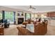 Spacious living room with fireplace, multiple seating areas, and access to the dining area, ideal for entertaining at 1027 Upchurch Farm Ln, Cary, NC 27519