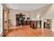 Spacious home office with hardwood floors, executive desk, and built-in shelving providing a professional workspace at 1027 Upchurch Farm Ln, Cary, NC 27519