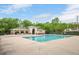 Community pool with ample seating and shade, perfect for summer relaxation at 1027 Upchurch Farm Ln, Cary, NC 27519