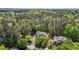 Overhead view of a lovely brick house nestled among mature trees in a peaceful setting at 103 Ticonderoga Rd, Cary, NC 27519