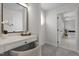 Elegant bathroom with a vanity area and a doorway to an ensuite with soaking tub and shower at 103 Ticonderoga Rd, Cary, NC 27519