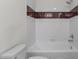 Cozy bathroom featuring a tile surround bathtub with modern white tiling and brushed hardware at 103 Ticonderoga Rd, Cary, NC 27519