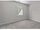 Bright bedroom featuring neutral paint, carpet, and natural light from the window at 103 Ticonderoga Rd, Cary, NC 27519