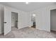 Spacious bedroom with plush neutral carpet has a nearby bathroom and large closet at 103 Ticonderoga Rd, Cary, NC 27519