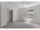 Neutral bedroom with carpet, window, ceiling fan, and closet at 103 Ticonderoga Rd, Cary, NC 27519