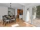 Dining area with hardwood floors located between kitchen and walkout to deck at 103 Ticonderoga Rd, Cary, NC 27519