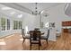 Bright dining room with skylights, hardwood floors, and a seating area with neighborhood views at 103 Ticonderoga Rd, Cary, NC 27519