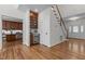 Spacious entryway with hardwood floors, bar area, and staircase to the upper level at 103 Ticonderoga Rd, Cary, NC 27519