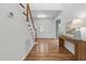 Welcoming foyer with hardwood floors, chandelier, and a staircase, offering a grand entrance at 103 Ticonderoga Rd, Cary, NC 27519