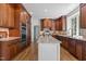 Gourmet kitchen featuring a large island, custom cabinets, and stainless steel appliances at 103 Ticonderoga Rd, Cary, NC 27519