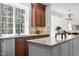 Bright kitchen with granite countertops, stainless steel appliances, and a view to a wooded lot at 103 Ticonderoga Rd, Cary, NC 27519