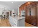 Bright kitchen island with granite countertop, custom cabinetry, and stainless appliances at 103 Ticonderoga Rd, Cary, NC 27519