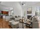 Bright living room with hardwood floors, vaulted ceilings, and a stone fireplace at 103 Ticonderoga Rd, Cary, NC 27519