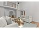 Bright living room with soaring ceilings, neutral furniture, and wood floors at 103 Ticonderoga Rd, Cary, NC 27519