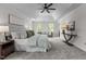 Spacious main bedroom featuring a tray ceiling, carpet floors, and plenty of natural light at 103 Ticonderoga Rd, Cary, NC 27519