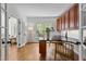 Well-appointed office space with hardwood floors, built-in cabinets, a functional desk area, and an abundance of natural light at 103 Ticonderoga Rd, Cary, NC 27519