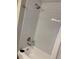 Bathroom with white tiled tub and shower at 1045 Nichols Dr, Raleigh, NC 27605